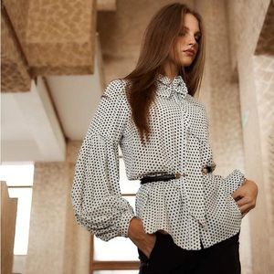 Elegant polka dot blouse with detachable bow